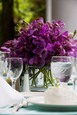 purple flowers and water glass